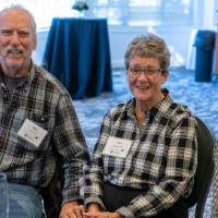 Three alumni sitting together.